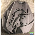 Pull tricot motif dinosaure