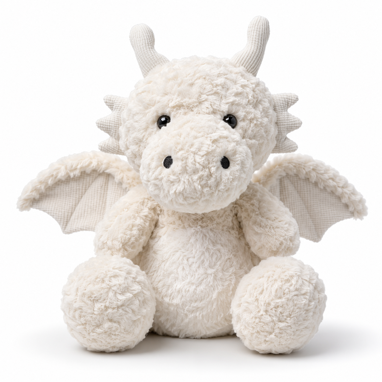 Peluche dinosaure Ptérosaure blanc posé sur une étagère