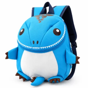 Cartable dinosaure bébé maternelle pas cher bleu posé sur une table d'école.