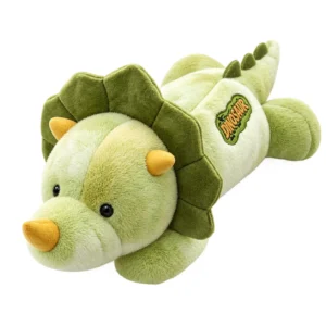 peluche douce dinosaure triceratops leste motif tie-dye sur canape